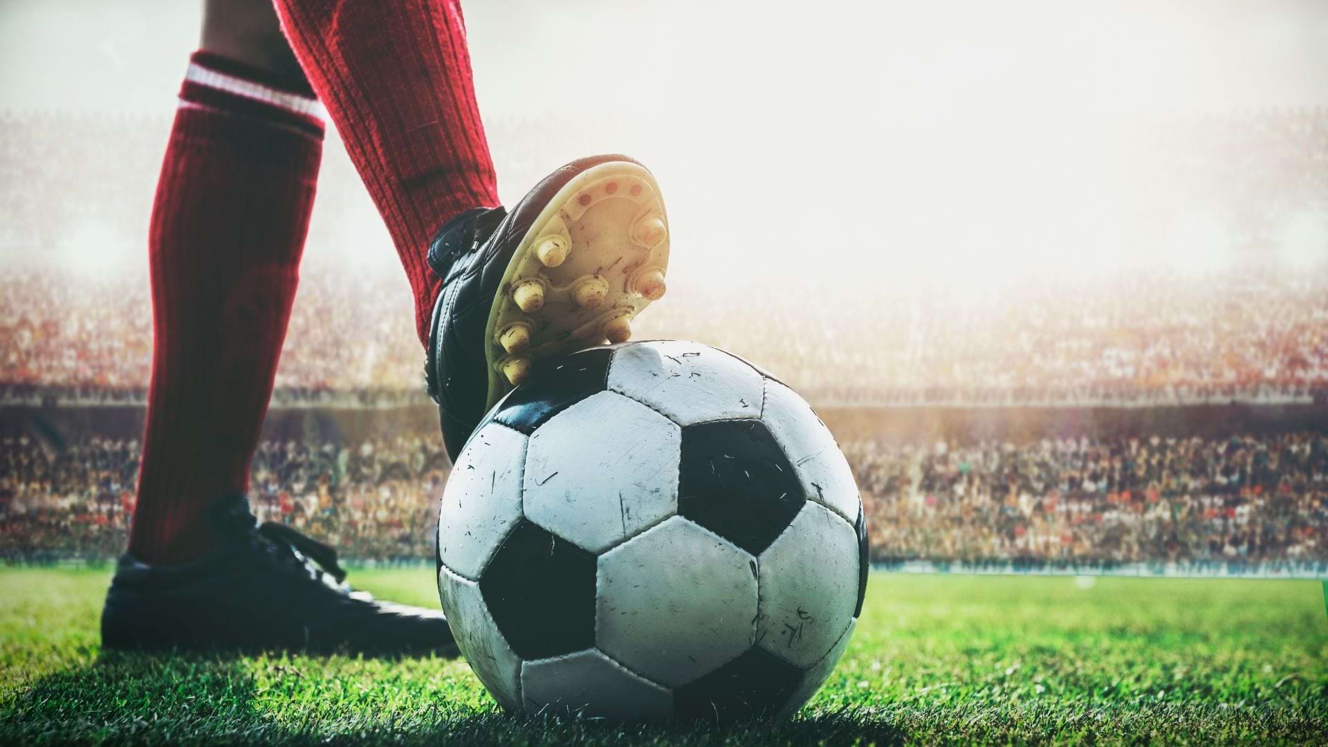 Athlete's foot on soccer ball.